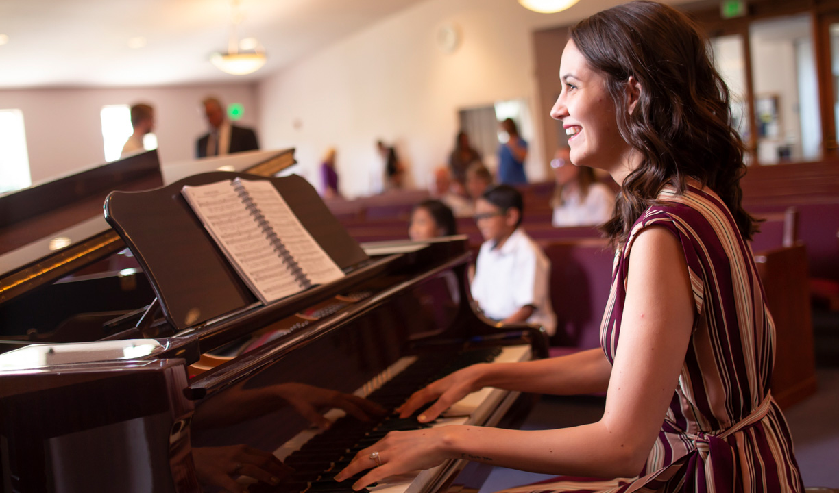 lady playing piano in church